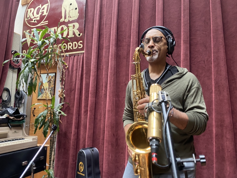 A photo of Craig Handy playing the saxophone at Wide Hive Records.