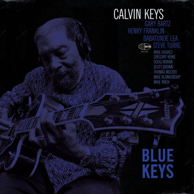 A photo with purple overtones of Calvin Keys playing guitar - for the cover of the album "Blue Keys"