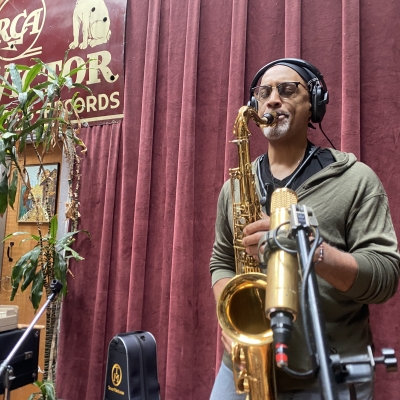 A photo of Craig Handy playing the saxophone at Wide Hive Records.