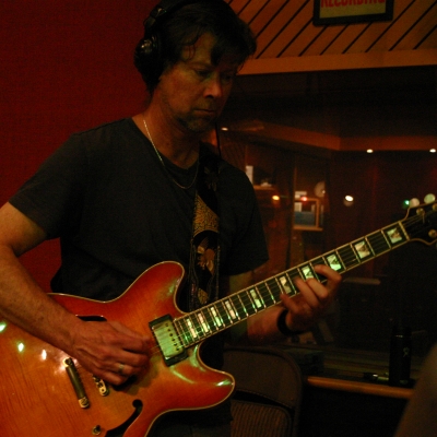 Dave MacNab playing a guitar.