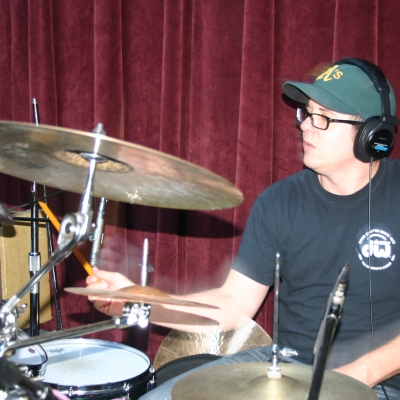 Mike "Lumpy" Hughes, playing drums on the Throttle Elevator Music release, "Jagged Rocks."