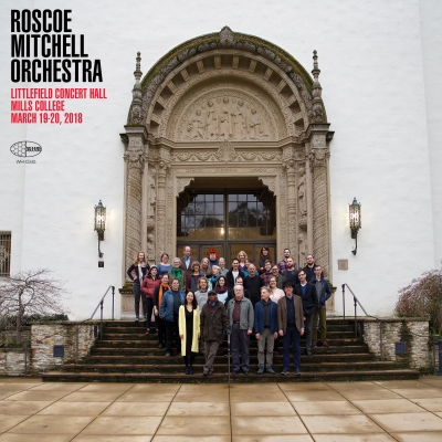 A photo of Roscoe Mitchell Orchestra standing on the steps of Littlefield Concert Hall at Mills College in Oakland, California.