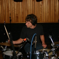 Lumpy playing the drums.